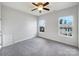 Bedroom featuring carpet, two windows, and great natural light at 3904 Hounslow Ln, Harrisburg, NC 28075