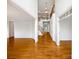 Bright open foyer with hardwood floors, tall ceilings and clear views of the staircase at 3904 Hounslow Ln, Harrisburg, NC 28075