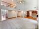 Spacious living room showcasing open floorplan, high ceilings, and hardwood floors leading to the kitchen and entryway at 3904 Hounslow Ln, Harrisburg, NC 28075