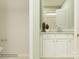 Well-lit bathroom featuring a white vanity with brushed nickel hardware, neutral wall paint, and a tiled shower at 3915 Horsham St, Indian Land, SC 29707