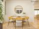 Bright dining room with modern round table, decorative rug, and elegant gold mirror at 3915 Horsham St, Indian Land, SC 29707