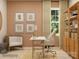 A well-lit office space featuring neutral walls, a sleek desk, and built-in wooden shelving at 3915 Horsham St, Indian Land, SC 29707