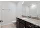 Bathroom features a dark wood vanity with granite countertop and tiled floors at 4527 Dover Ct, Denver, NC 28037