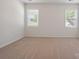 Spacious bedroom with neutral carpet and two windows offering ample natural light at 4527 Dover Ct, Denver, NC 28037