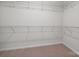 Spacious walk-in closet featuring ample storage with wire shelving on multiple levels at 4527 Dover Ct, Denver, NC 28037