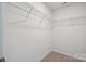 Walk-in closet with carpet flooring and wire shelving for organized storage at 4527 Dover Ct, Denver, NC 28037