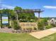 Welcoming community entrance sign with lush landscaping and manicured lawn at 4527 Dover Ct, Denver, NC 28037