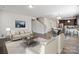 Inviting living room and kitchen area with neutral tones and modern finishes at 4527 Dover Ct, Denver, NC 28037