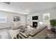 Bright living room featuring a fireplace, modern furnishings, and wood-look floors at 4527 Dover Ct, Denver, NC 28037
