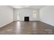 Spacious living room highlighting the fireplace and wood-look flooring at 4527 Dover Ct, Denver, NC 28037