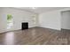 Expansive living room with a fireplace and light-filled open space at 4527 Dover Ct, Denver, NC 28037