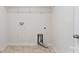 Utility room featuring hookups, tile floor, and wire shelving unit at 4527 Dover Ct, Denver, NC 28037