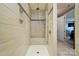 Clean bathroom boasts a large, tiled walk-in shower with built-in bench at 475 Hunton Forest Nw Dr, Concord, NC 28027