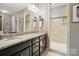Beautiful bathroom with dual vanity, granite countertops, and glass shower at 475 Hunton Forest Nw Dr, Concord, NC 28027