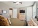 Bedroom featuring neutral colors, plush bedding, and a television for entertainment at 475 Hunton Forest Nw Dr, Concord, NC 28027