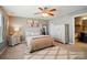 Bedroom featuring neutral colors, plush bedding, and a ceiling fan at 475 Hunton Forest Nw Dr, Concord, NC 28027