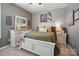 Cozy bedroom with neutral tones, decorative accents and a comfortable bed setting at 475 Hunton Forest Nw Dr, Concord, NC 28027
