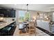 Cozy dining area featuring a farmhouse table, wooden chairs, and large windows offering great sunlight and views at 475 Hunton Forest Nw Dr, Concord, NC 28027
