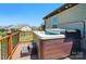 Outdoor hot tub on the deck, perfect for relaxation and enjoying the surrounding views at 475 Hunton Forest Nw Dr, Concord, NC 28027