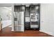 Sleek kitchen featuring stainless steel appliances, dark wood cabinets, and hardwood floors, great for cooking prep at 475 Hunton Forest Nw Dr, Concord, NC 28027