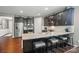 Modern kitchen boasting granite countertops, stainless steel appliances, and dark cabinetry, perfect for cooking at 475 Hunton Forest Nw Dr, Concord, NC 28027