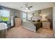 Spacious main bedroom boasts lots of light, neutral paint, and ceiling fan at 475 Hunton Forest Nw Dr, Concord, NC 28027