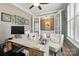Spacious office with custom built-ins, neutral walls, and ample natural light, creating a productive workspace at 475 Hunton Forest Nw Dr, Concord, NC 28027