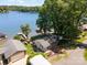Aerial view of a waterfront property with private dock, treed landscape, and tranquil lake access at 4960 Longfield St, Claremont, NC 28610