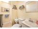 Modest bathroom with a single sink, toilet, decorative mirror, and shower with towel rack for everyday function at 4960 Longfield St, Claremont, NC 28610