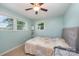 Bright bedroom featuring neutral carpeting, a ceiling fan, and plenty of natural light at 4960 Longfield St, Claremont, NC 28610