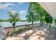 Spacious deck with wood railings offering picturesque waterfront views, great for relaxing and enjoying nature at 4960 Longfield St, Claremont, NC 28610
