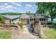 Inviting waterfront home with pretty landscaping, complemented by lush greenery and picturesque lake views at 4960 Longfield St, Claremont, NC 28610