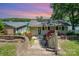 Charming home with beautiful landscaping, including red roses and a glimpse of the lake at sunset at 4960 Longfield St, Claremont, NC 28610