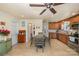 Spacious kitchen with wooden cabinets, stainless steel appliances, granite countertops, and a dining table with seating at 4960 Longfield St, Claremont, NC 28610