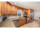 Modern kitchen featuring stainless steel appliances, granite countertops, and custom wooden cabinetry at 4960 Longfield St, Claremont, NC 28610