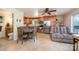 Open concept kitchen with wooden cabinets, stainless steel appliances, tile floors, and a dining table with chairs at 4960 Longfield St, Claremont, NC 28610