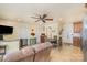 Bright and airy living room featuring tile floors, a ceiling fan, and a comfortable couch at 4960 Longfield St, Claremont, NC 28610