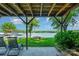 Lakeside patio with outdoor seating and a fire pit, providing a serene and inviting space for relaxation and entertaining at 4960 Longfield St, Claremont, NC 28610