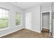 Bright bedroom featuring carpet, multiple windows, and a closet at 526 N Davidson St, Charlotte, NC 28202