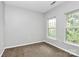 Bright bedroom with carpet, two windows and natural light at 526 N Davidson St, Charlotte, NC 28202