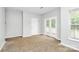 Bright bedroom with carpeting and glass patio doors at 526 N Davidson St, Charlotte, NC 28202