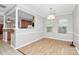 Open dining area with hardwood floors and modern chandelier at 526 N Davidson St, Charlotte, NC 28202