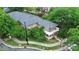 Exterior of condo with a lovely patio area shaded by mature trees at 526 N Davidson St, Charlotte, NC 28202