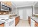 Spacious kitchen featuring stone countertops, oak cabinets, and tiled floors at 526 N Davidson St, Charlotte, NC 28202