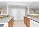 Spacious kitchen featuring stone countertops, oak cabinets, and tiled floors at 526 N Davidson St, Charlotte, NC 28202