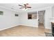 Bright living room featuring wood floors, modern ceiling fan and view of the kitchen at 526 N Davidson St, Charlotte, NC 28202
