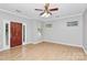 Inviting living room featuring wood floors, neutral paint and a stylish front door at 526 N Davidson St, Charlotte, NC 28202