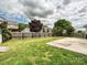 A lush backyard with a concrete patio, a privacy fence, and mature trees for shade at 5355 Hackberry Sw Ln, Concord, NC 28027