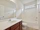 Well-lit bathroom featuring a sink with vanity and a shower-tub combo, providing a clean and functional space at 5355 Hackberry Sw Ln, Concord, NC 28027