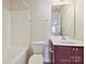 Clean bathroom featuring a combined shower and bathtub, toilet, vanity, and mirrored cabinets at 5355 Hackberry Sw Ln, Concord, NC 28027